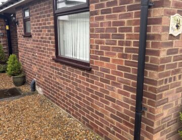 Original brick exterior of a bungalow in Melbourn SG8 before cladding installation.