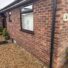 Original brick exterior of a bungalow in Melbourn SG8 before cladding installation.