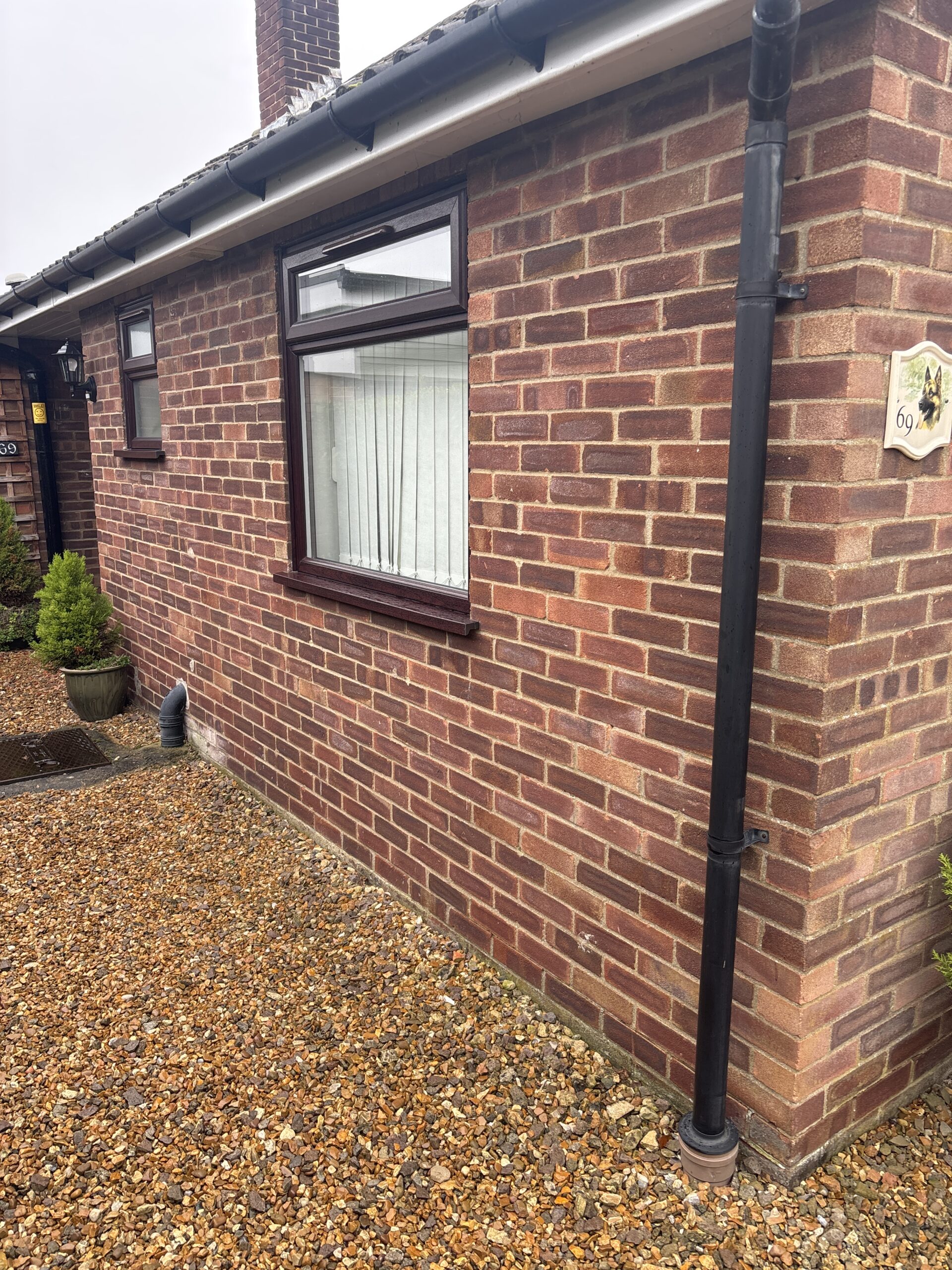 Original brick exterior of a bungalow in Melbourn SG8 before cladding installation.